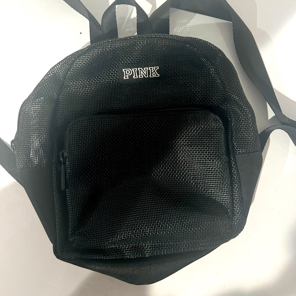 Pink Brand Black mini backpack.